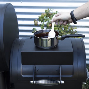 The offset lid doubles as a cooktop, ideal for cooking sauces