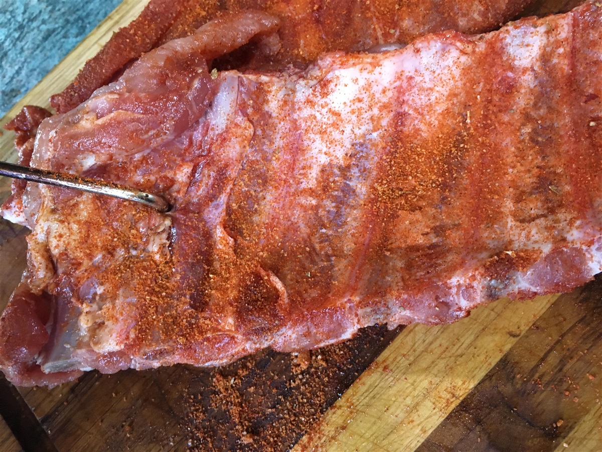 Liberally rub your ribs and place the hook in between the second and third rib.