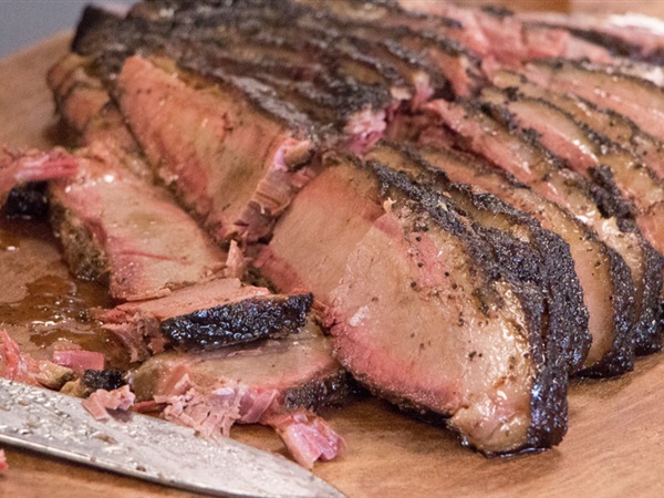 Don't panic! A pink smoke ring on a brisket is a prized result. It's created by chemical reactions between smoke and meat.
