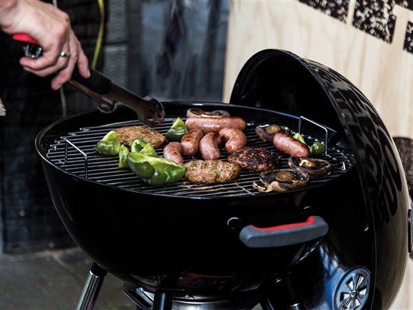 cooking up a storm on a Charmate Corona charcoal kettle bbq